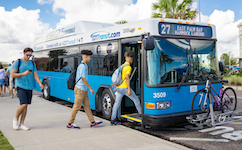 students getting on bus
